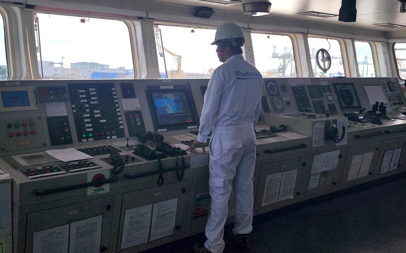 wheelhouse service engineer with navigation equipment