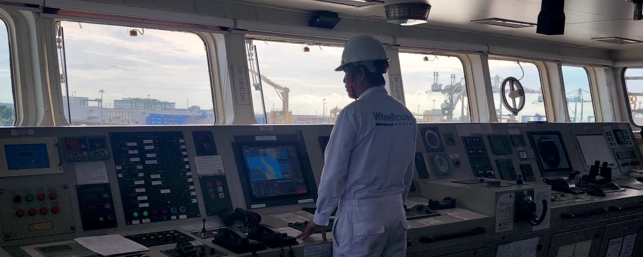 Wheelhouse service engineer inspecting the equipment on bridge