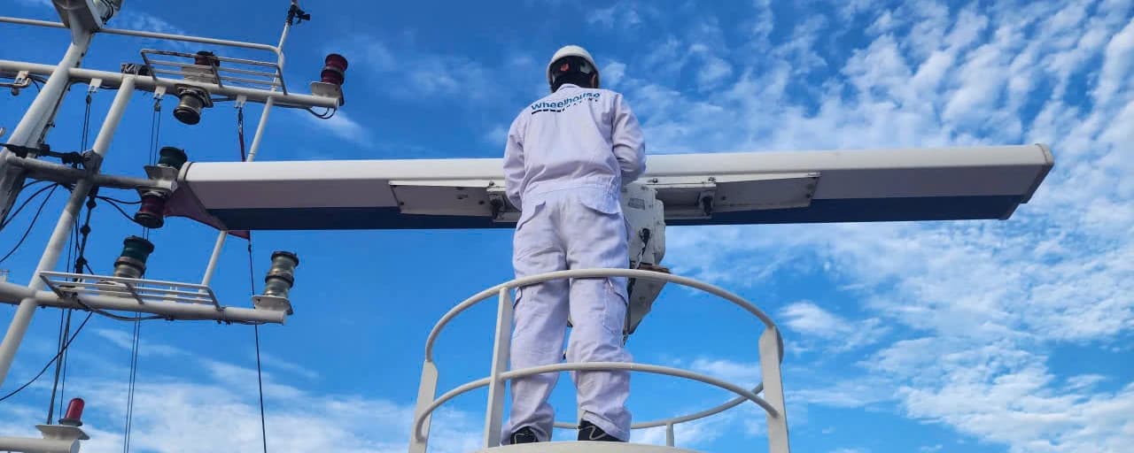 Wheelhouse service engineer inspecting the radar antenna on board